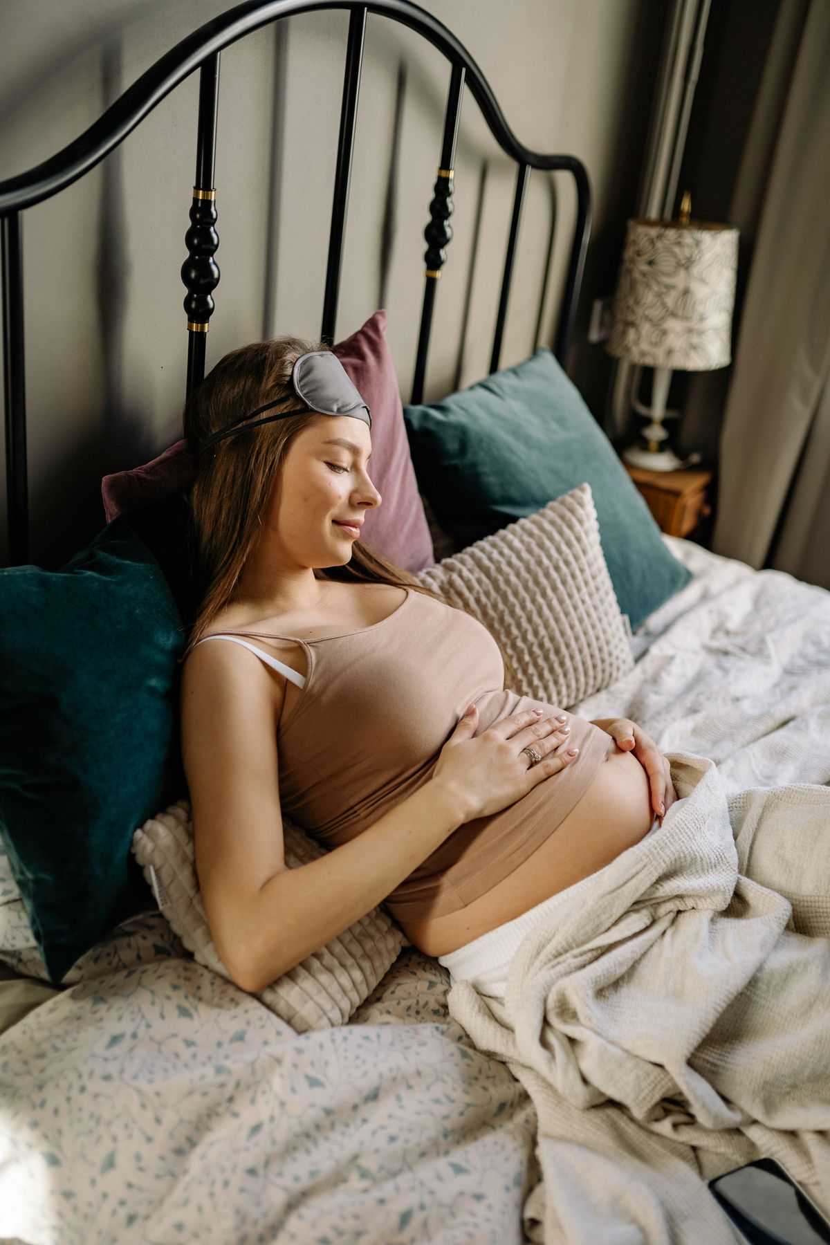 Founder fitting a belly support band on an expecting mom